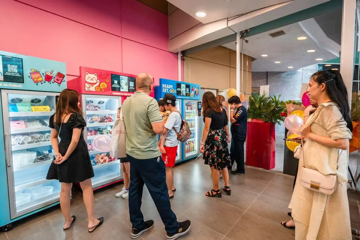 Shopper using a Pink in Public smart retail cabinet